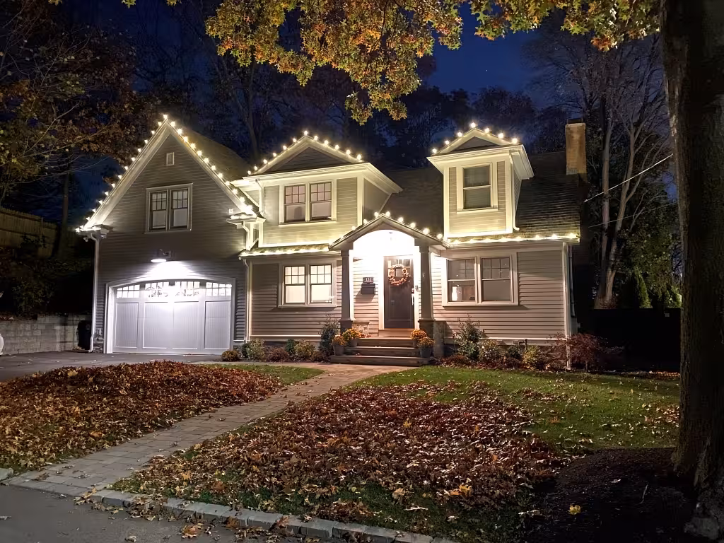 Newton MA home with professional Christmas lights installation and holiday decorations